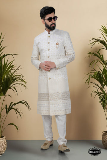 WHITE-BASE SHERWANI SET WITH HEAVY PANEL & THREAD EMBROIDERY ALL-OVER